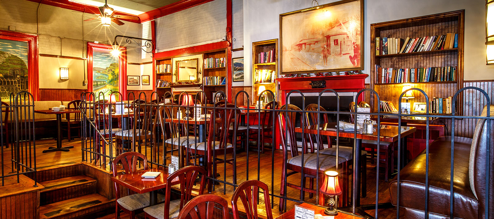 Cold Spring Depot dining room interior with bookshelves and fireplace